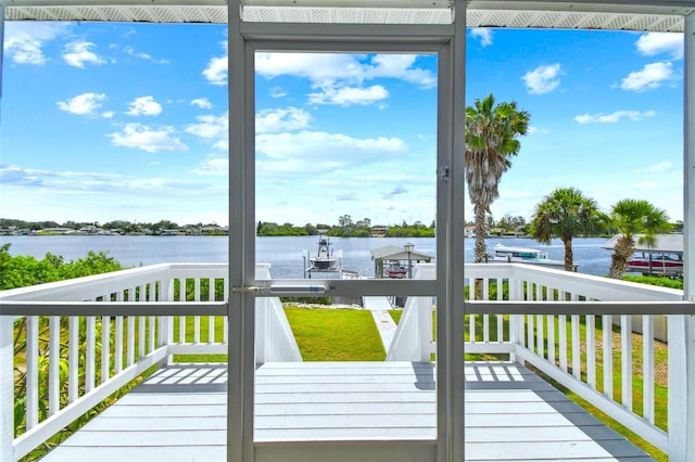 deck featuring a water view and a boat dock