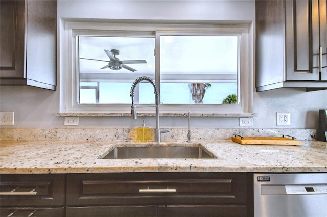 kitchen featuring dishwasher, a healthy amount of sunlight, and dark brown cabinetry