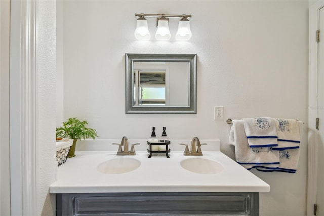 bathroom with dual vanity