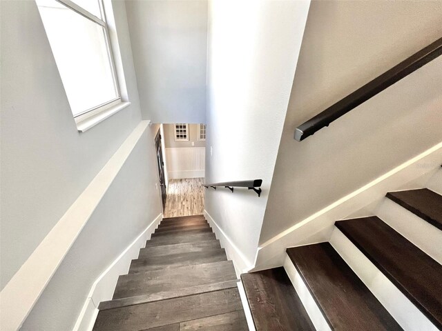 stairway with dark wood-type flooring