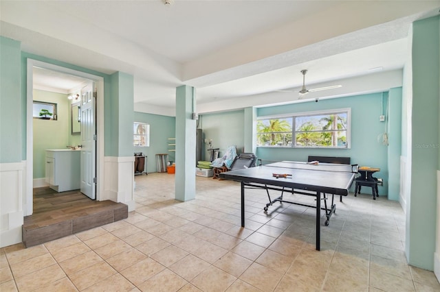 game room featuring light tile patterned flooring and ceiling fan