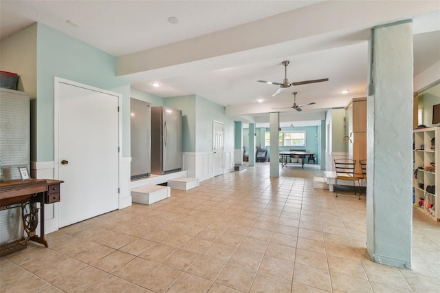 tiled living room featuring ceiling fan