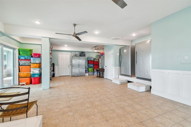 interior space featuring ceiling fan