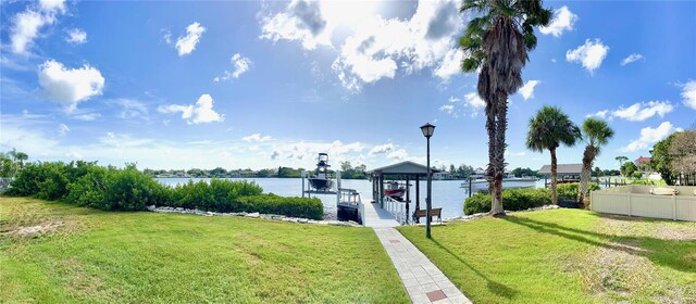 exterior space with a dock and a water view