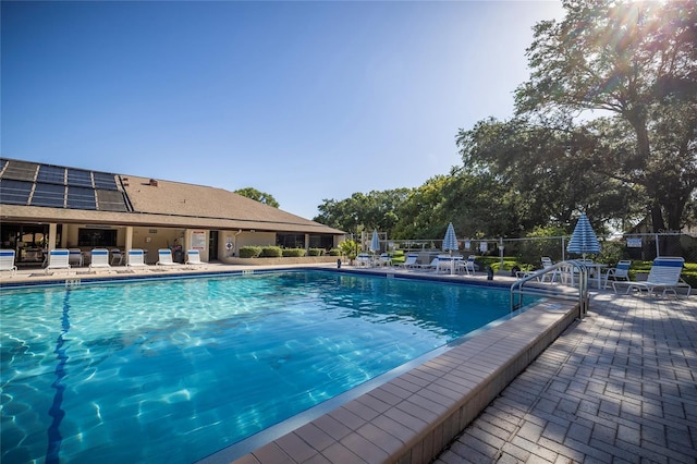 view of swimming pool with a patio