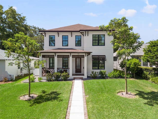 view of front of home featuring a front lawn and a porch