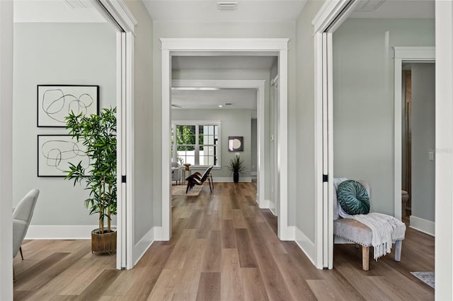 corridor featuring light hardwood / wood-style flooring