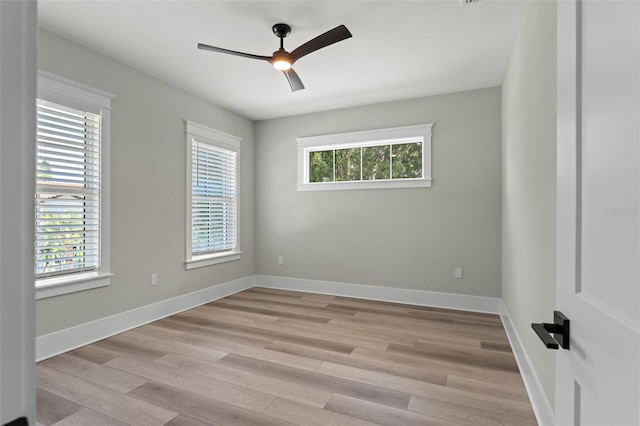 spare room featuring ceiling fan and light hardwood / wood-style flooring