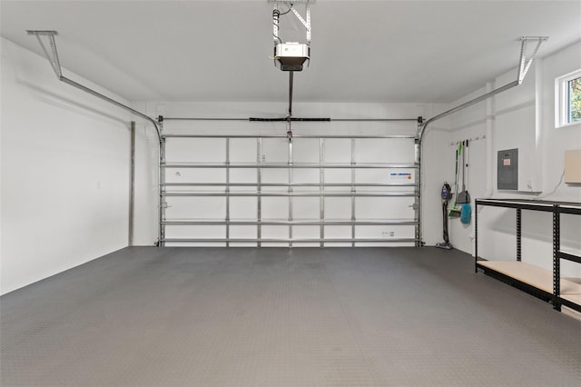 garage with electric panel and a garage door opener