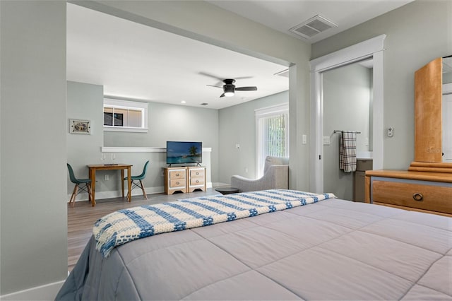 bedroom featuring hardwood / wood-style flooring and ceiling fan