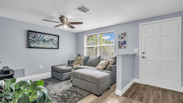 living room featuring ceiling fan