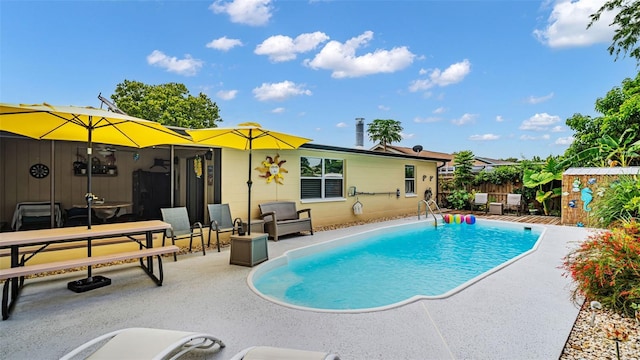 view of swimming pool featuring a patio area