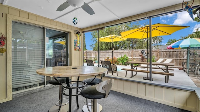 sunroom / solarium with ceiling fan