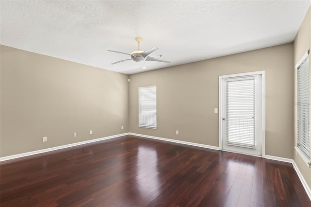 empty room with ceiling fan and hardwood / wood-style floors