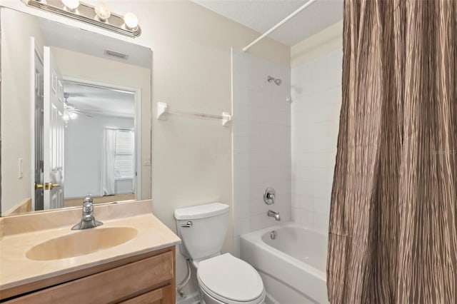 full bathroom with vanity, toilet, shower / bath combo with shower curtain, and a textured ceiling