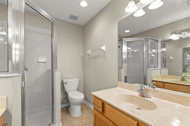 bathroom with tile patterned flooring, vanity, an enclosed shower, and toilet