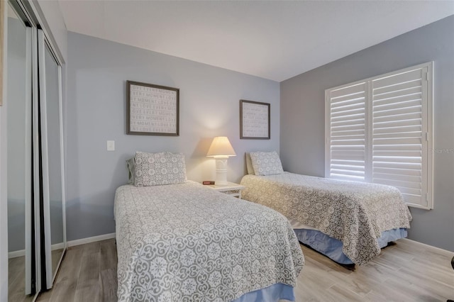 bedroom featuring hardwood / wood-style flooring and a closet