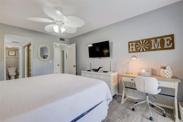 bedroom featuring ceiling fan, ensuite bathroom, and light hardwood / wood-style flooring