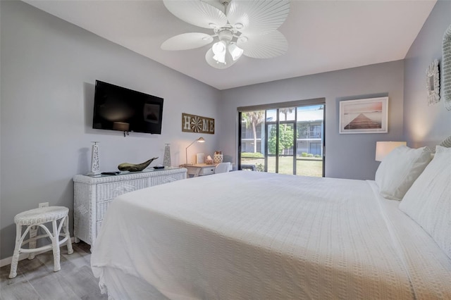 bedroom featuring access to outside, ceiling fan, and light hardwood / wood-style floors