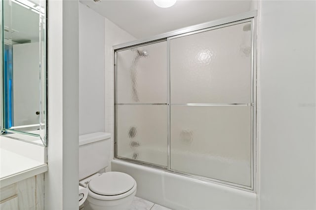 bathroom featuring enclosed tub / shower combo and toilet