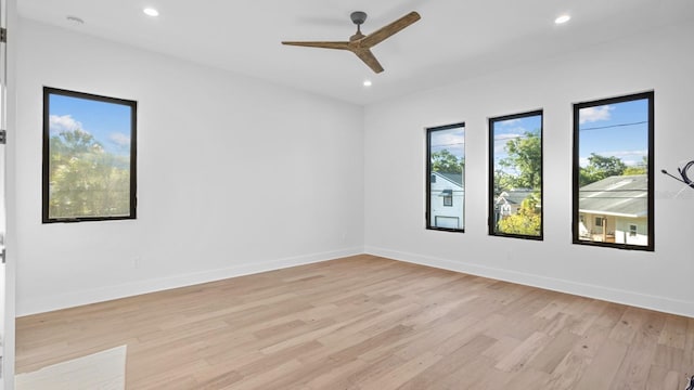 unfurnished room with a ceiling fan, recessed lighting, baseboards, and light wood finished floors