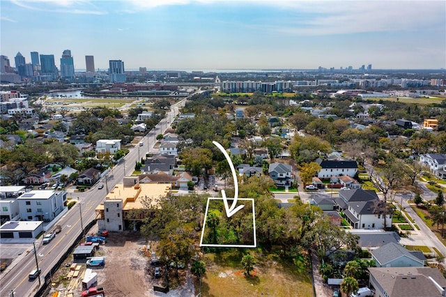 birds eye view of property with a city view