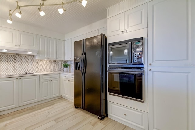 kitchen with white cabinetry, light hardwood / wood-style floors, decorative backsplash, and black appliances