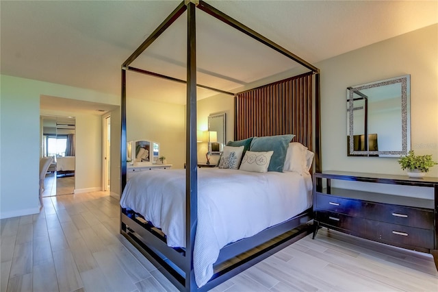 bedroom with light hardwood / wood-style flooring