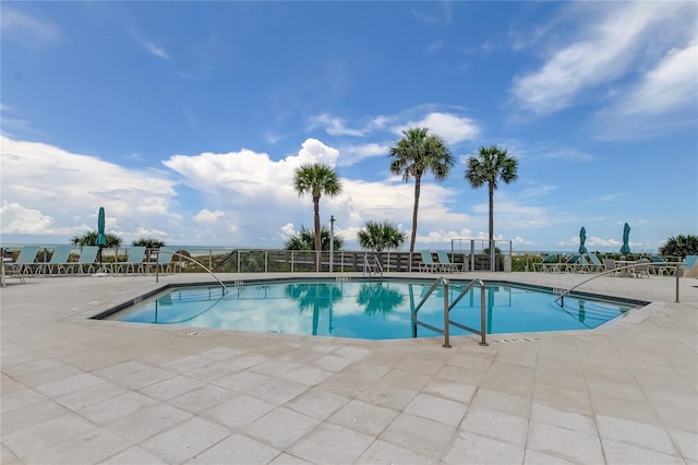 view of swimming pool with a patio