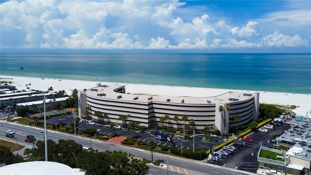 bird's eye view featuring a view of the beach and a water view