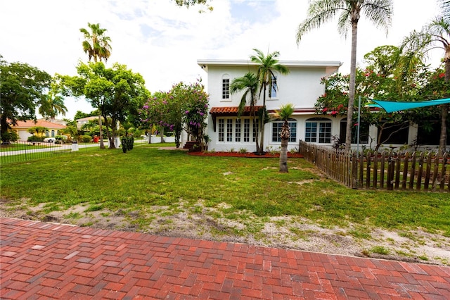 rear view of house with a yard