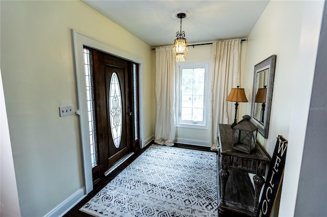 foyer with dark hardwood / wood-style floors