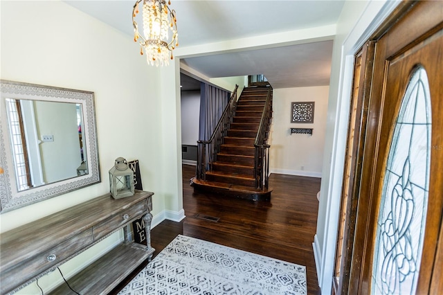 foyer featuring dark hardwood / wood-style floors and a notable chandelier