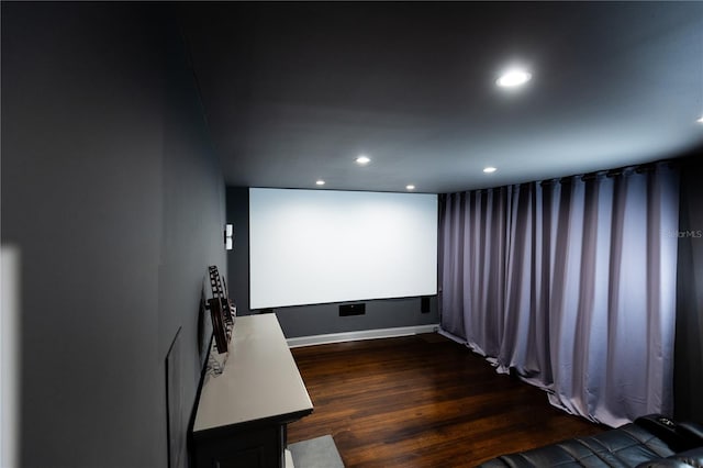 cinema featuring dark hardwood / wood-style flooring