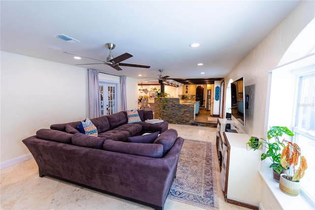 living room featuring ceiling fan