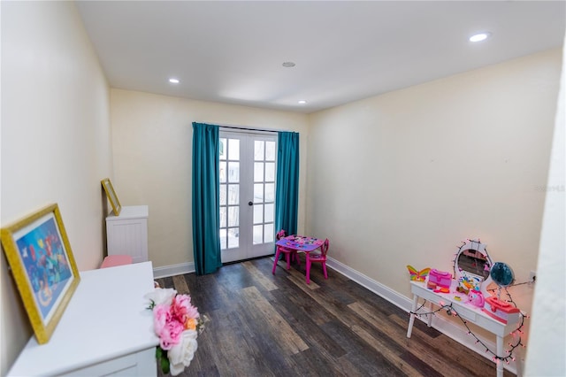 game room with dark hardwood / wood-style flooring and french doors