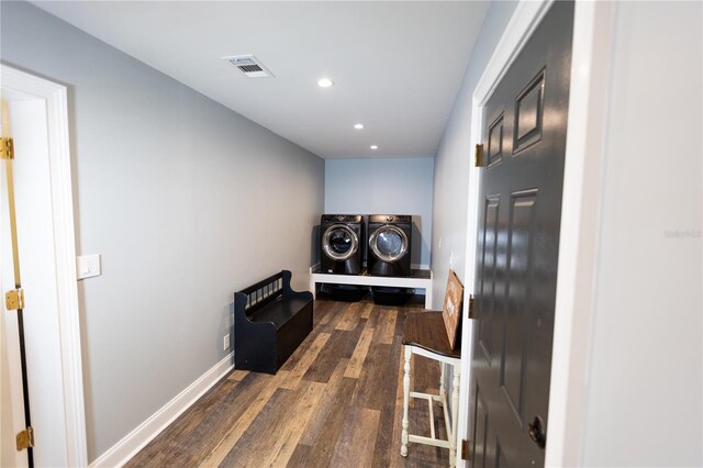 laundry area featuring separate washer and dryer and dark hardwood / wood-style floors