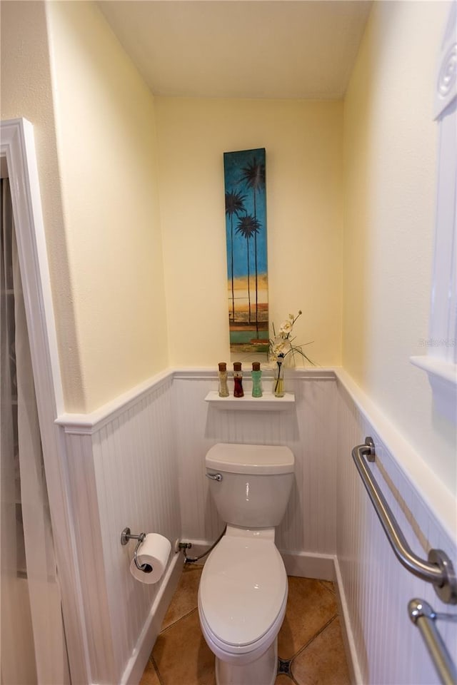 bathroom with tile patterned floors and toilet