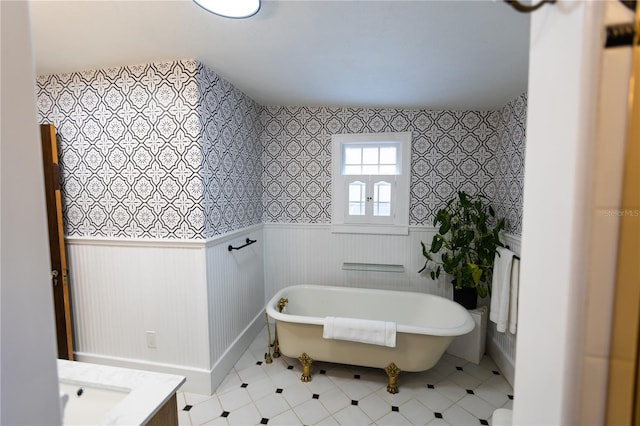 bathroom with vanity and a tub