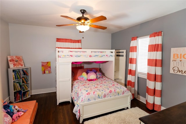 bedroom featuring ceiling fan and dark hardwood / wood-style floors