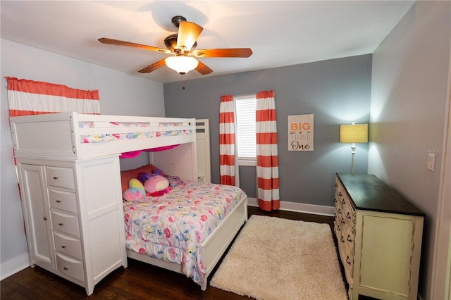 bedroom with ceiling fan and dark hardwood / wood-style flooring