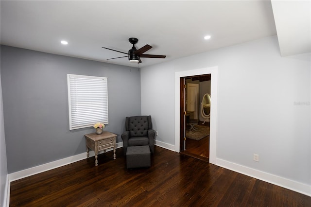 sitting room with dark hardwood / wood-style flooring and ceiling fan