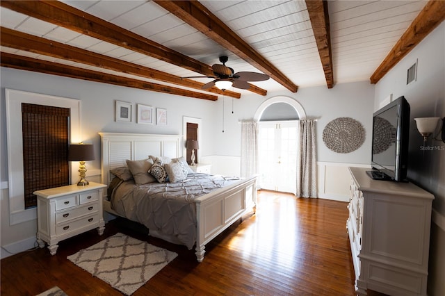 bedroom with dark wood-type flooring and beamed ceiling