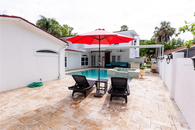 view of swimming pool featuring an in ground hot tub, ceiling fan, and a patio