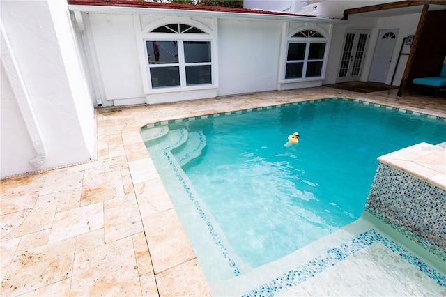 view of pool featuring a patio