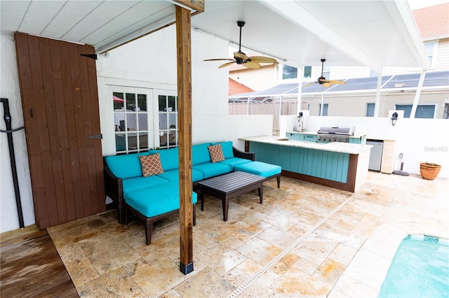 view of patio with an outdoor kitchen, grilling area, outdoor lounge area, and an outdoor bar