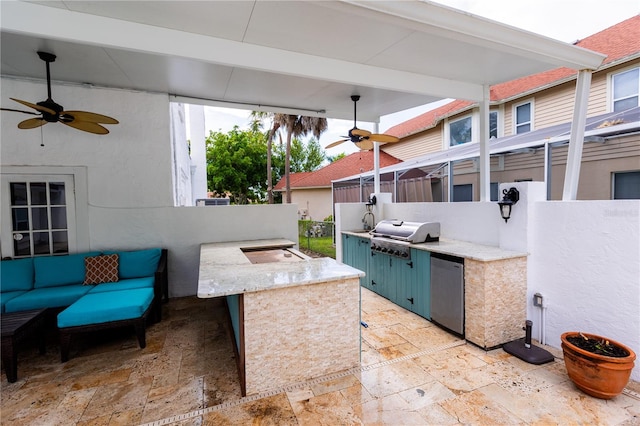 view of patio featuring a grill, an outdoor bar, ceiling fan, and an outdoor kitchen