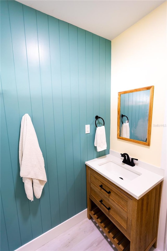 bathroom featuring vanity and wood-type flooring