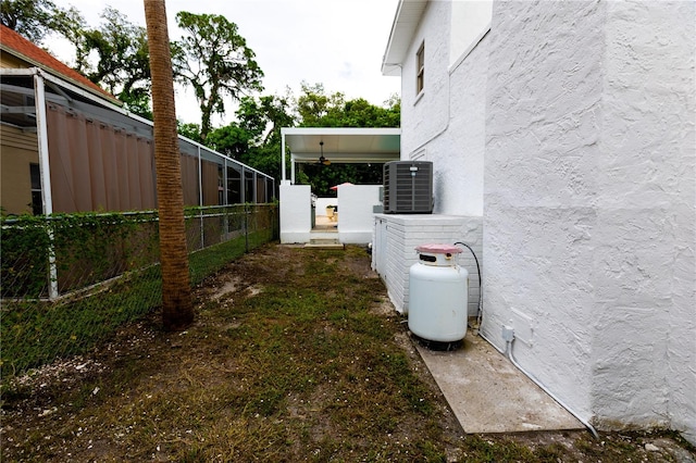 view of yard with central AC unit