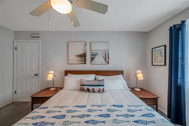 bedroom with a textured ceiling, carpet, visible vents, and a ceiling fan